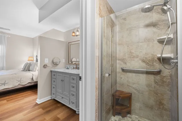 a view of a porch with a floor to ceiling window and tree