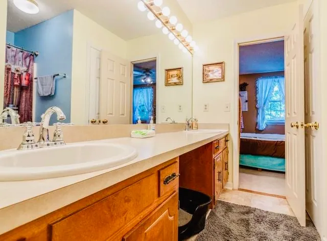 a bathroom with a sink and a mirror