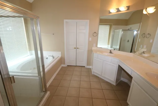 a bathroom with a sink a mirror and a bathtub