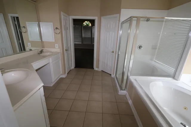 a bathroom with a bathtub and a sink