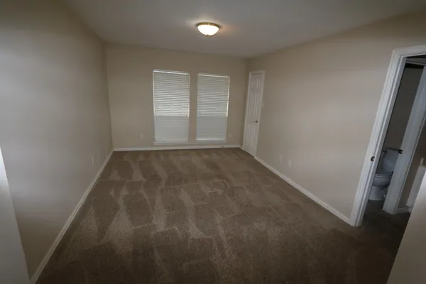 a bathroom with a toilet and a bathtub