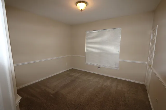 a bathroom with a sink toilet and a mirror