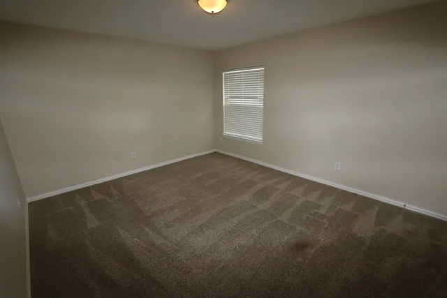 a bathroom with a double vanity sink and a large mirror
