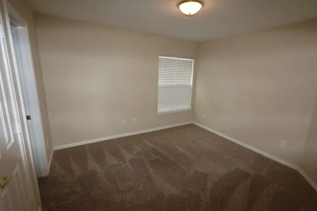a room with a sink and a window