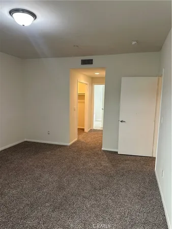 an empty room with an empty space and a window