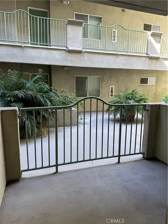 a view of a house with a flower garden