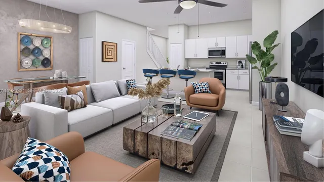 a living room with furniture a flat screen tv and a couch