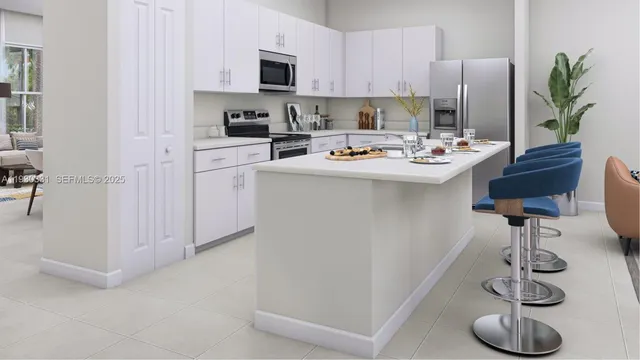 a kitchen with a sink stainless steel appliances and cabinets