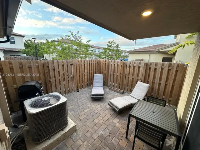 a view of a chairs in patio
