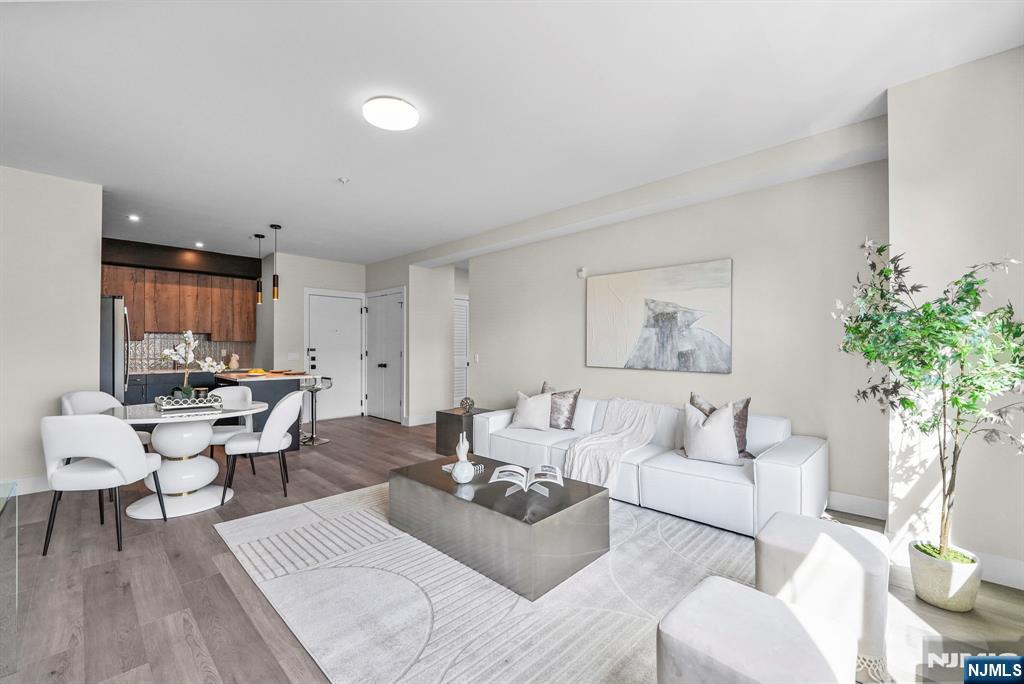 2021 Jones Road, Unit 102 Fort Lee, NJ 07024 - Photo 2 of 11 a living room with furniture and a potted plant