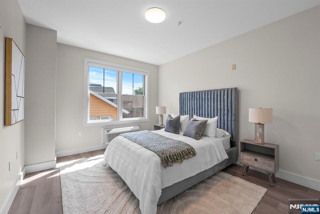 2021 Jones Road, Unit 102 Fort Lee, NJ 07024 - Photo 7 of 11 a bedroom with a bed and a window