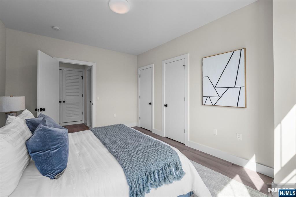 2021 Jones Road, Unit 102 Fort Lee, NJ 07024 - Photo 8 of 11 a bedroom with a large bed and a window