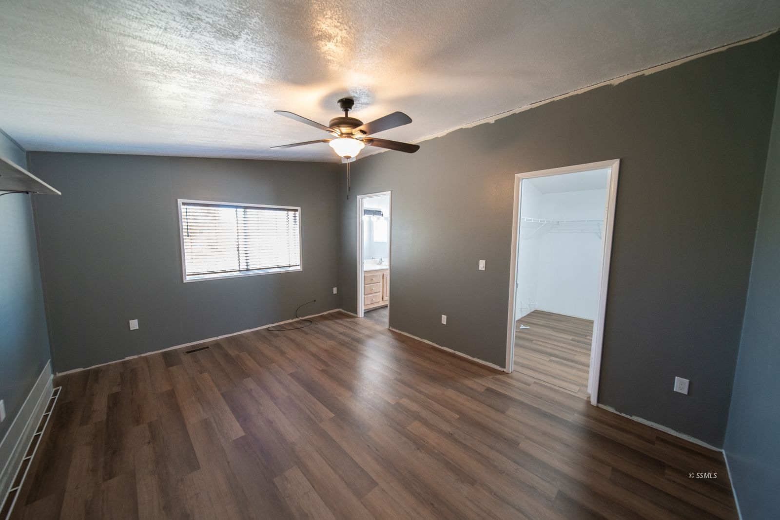 1219 South Garth Street Ridgecrest, CA 93555 - Photo 14 of 23 wooden floor in an empty room with a window