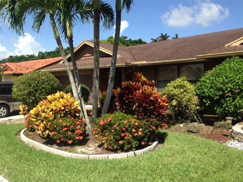 19508 Hampton Drive Boca Raton, FL 33434 - Photo 2 of 13 Beautiful Landscaping in Front of house