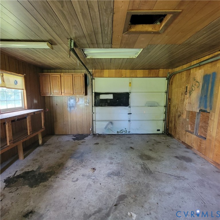 21090 Blackjack Road Culpeper, VA 22701 - Photo 13 of 16 Garage with wooden walls and wood ceiling