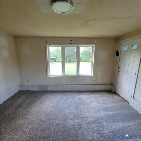 a view of a room that has a window in it
