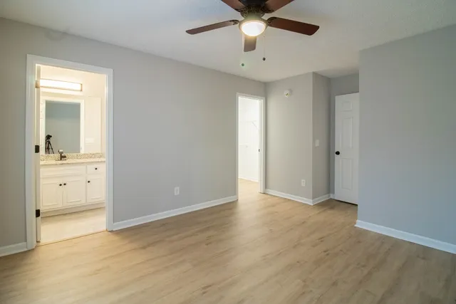 an empty room with a bathroom and a sink