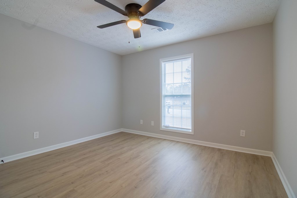 7001 Hunter Hill Court Columbus, GA 31907 - Photo 14 of 19 an empty room with wooden floor and windows