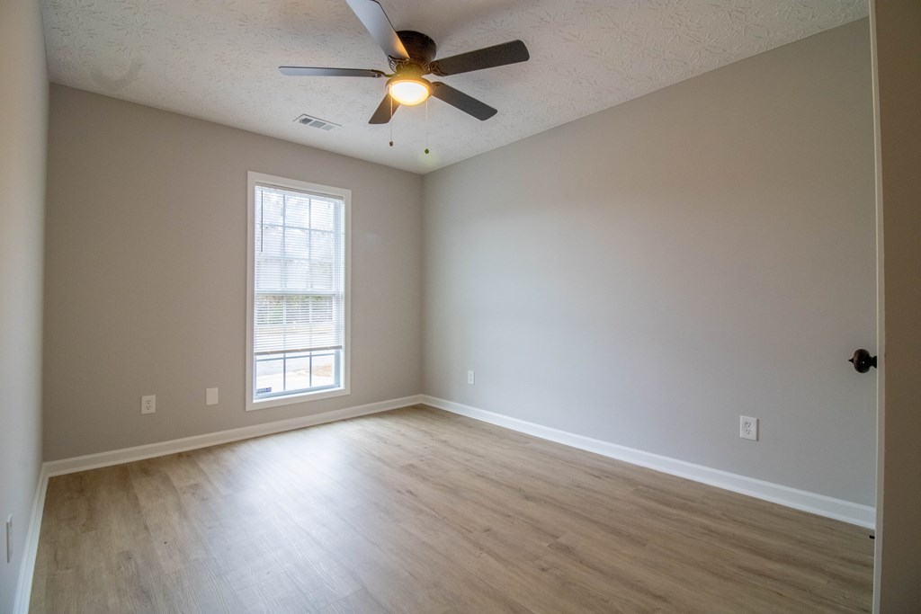 7001 Hunter Hill Court Columbus, GA 31907 - Photo 16 of 19 an empty room with wooden floor and windows