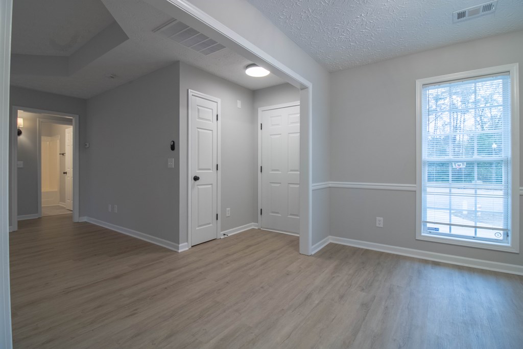 7001 Hunter Hill Court Columbus, GA 31907 - Photo 4 of 19 an empty room with wooden floor and windows