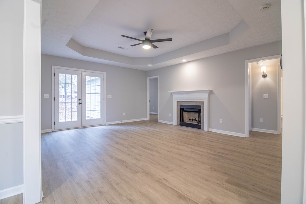 7001 Hunter Hill Court Columbus, GA 31907 - Photo 8 of 19 a view of an empty room with a fireplace and a window
