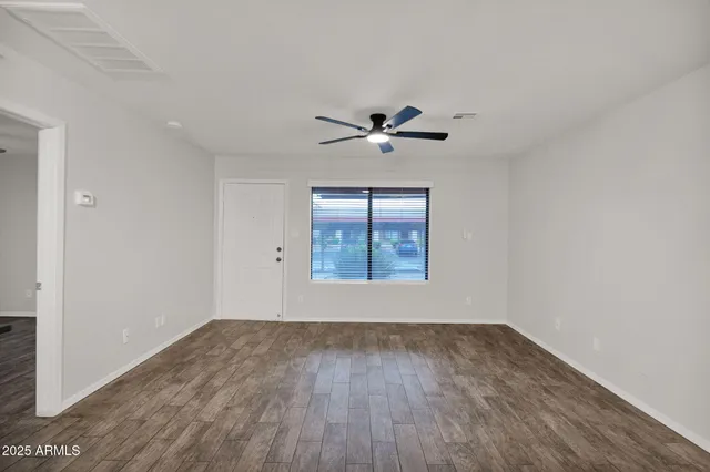 a view of an empty room with a window