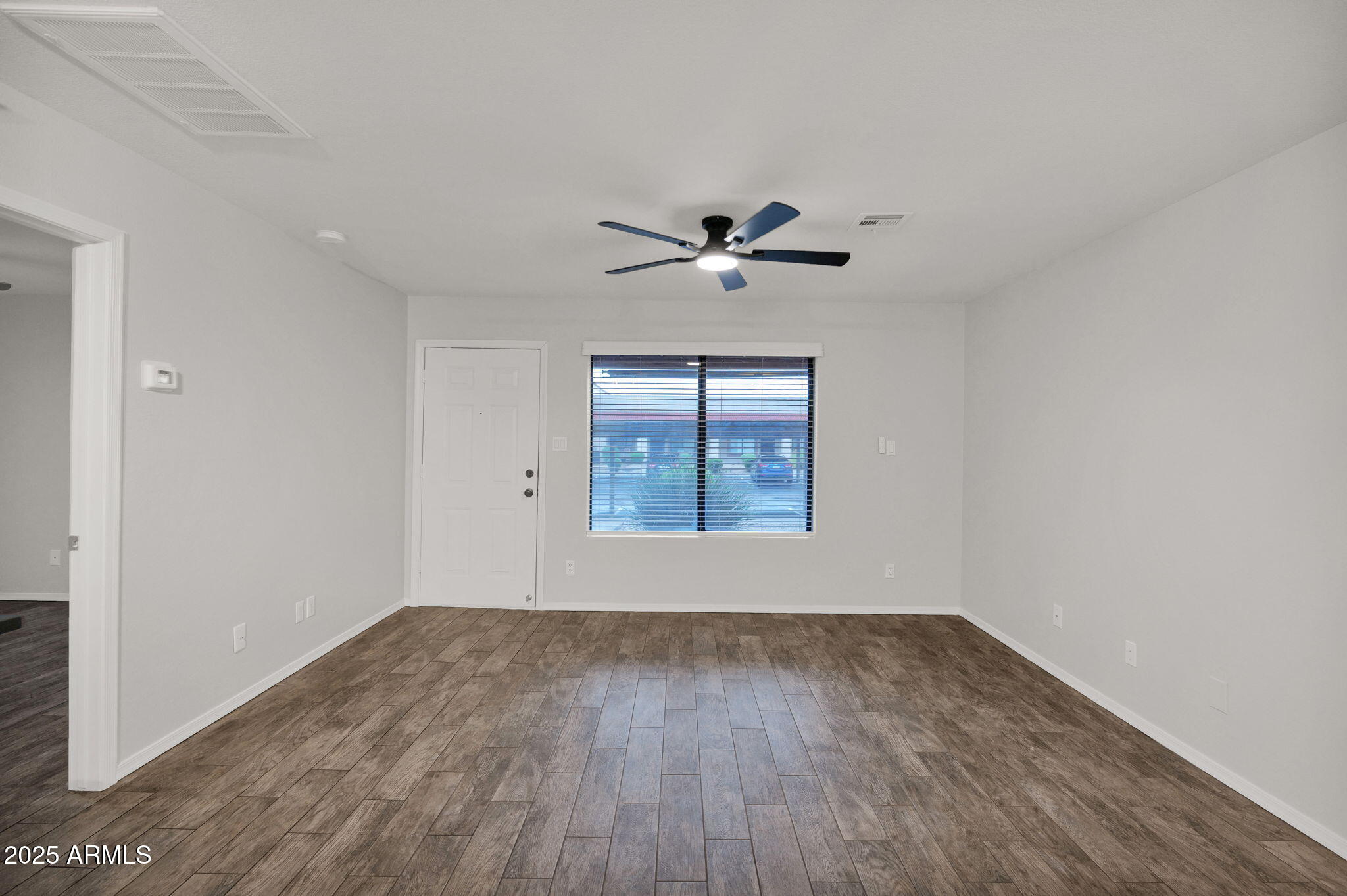 1440 North Idaho Road, Unit 1021 Apache Junction, AZ 85119 - Photo 11 of 26 a view of an empty room with a window
