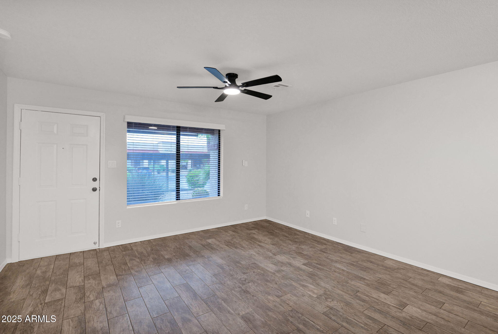 1440 North Idaho Road, Unit 1021 Apache Junction, AZ 85119 - Photo 12 of 26 a view of room with a ceiling fan and window