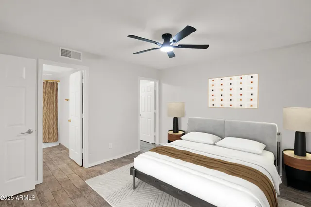 a bedroom with a bed and a window