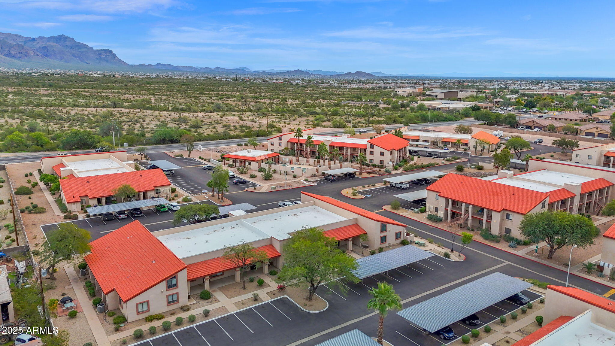 1440 North Idaho Road, Unit 1021 Apache Junction, AZ 85119 - Photo 24 of 26 an aerial view of a city with lots of residential buildings and ocean view