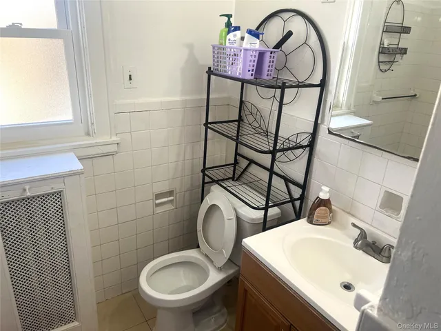 a living room with furniture and a toilet