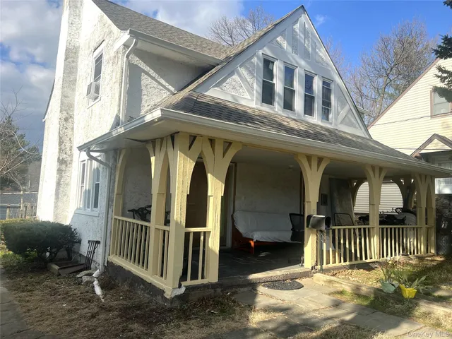 a front view of a house with a porch