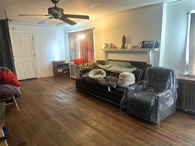 a bedroom with furniture and a wooden floor