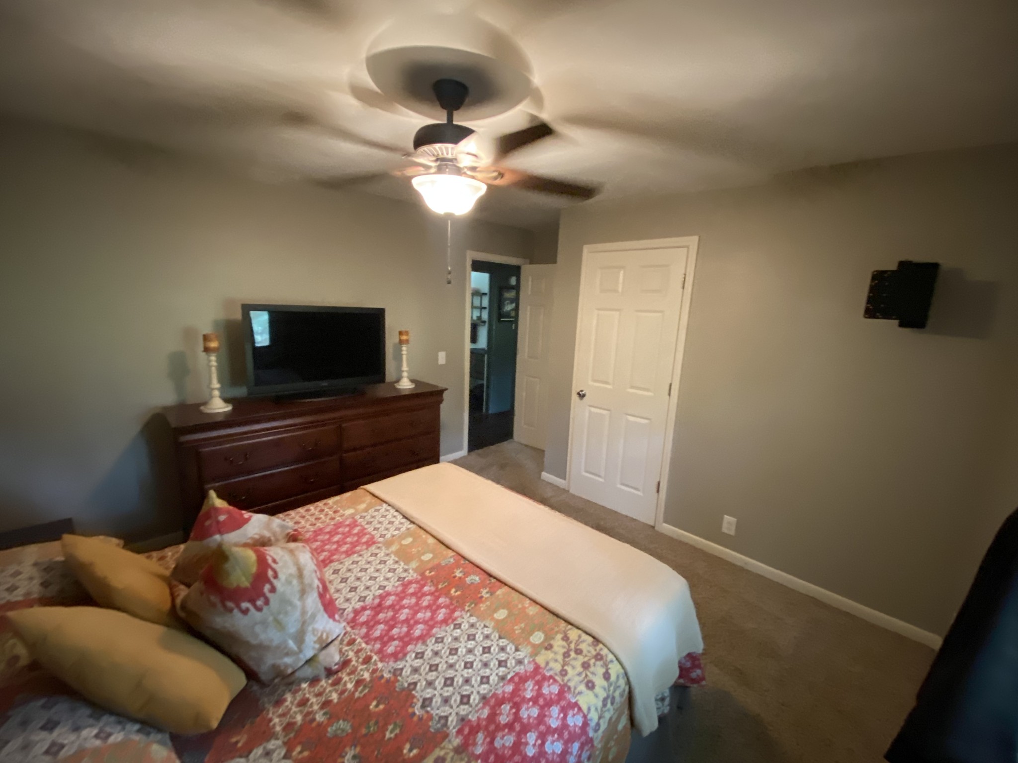 7305 Bethshears Road Fairview, TN 37062 - Photo 12 of 41 a bedroom with a bed and a flat screen tv