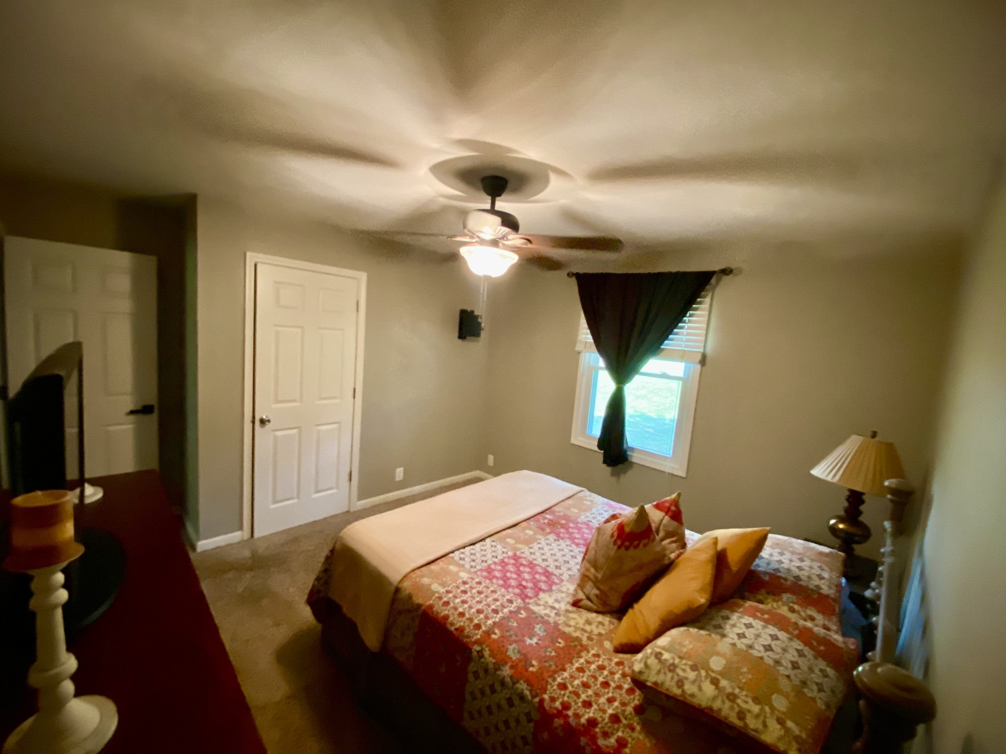 7305 Bethshears Road Fairview, TN 37062 - Photo 13 of 41 a bedroom with a bed and a chandelier