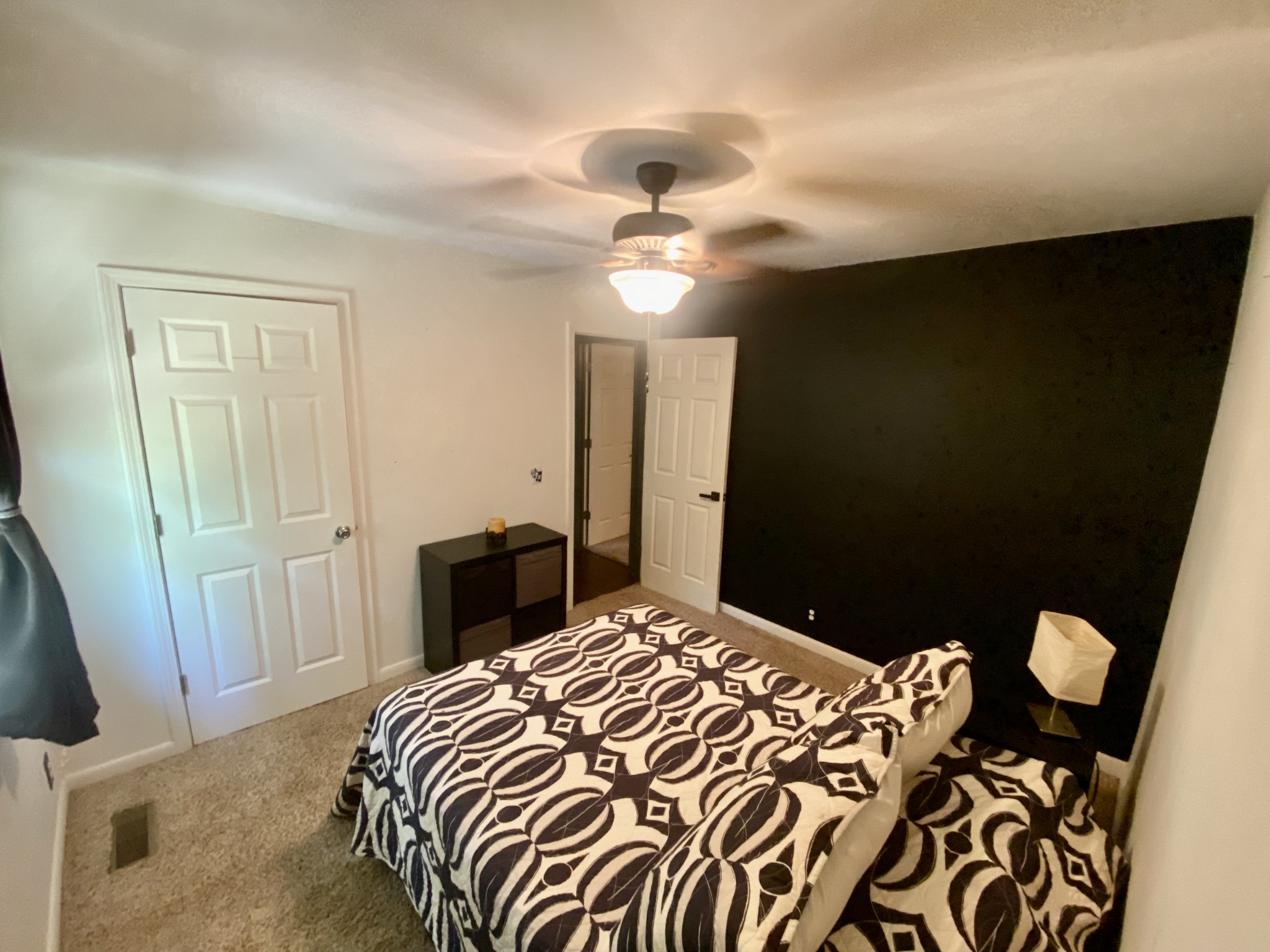 7305 Bethshears Road Fairview, TN 37062 - Photo 14 of 41 a bedroom with a bed and a chandelier