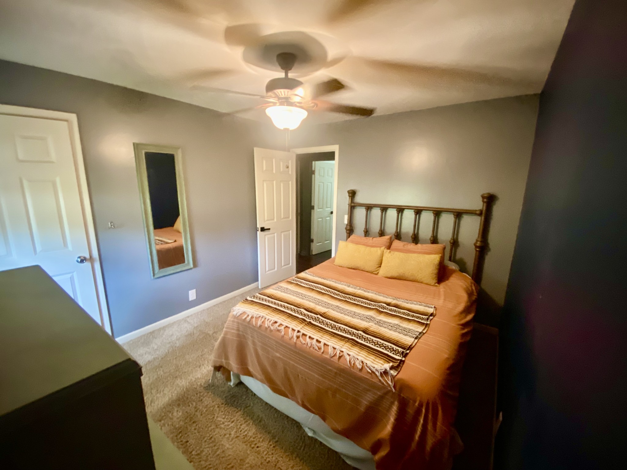 7305 Bethshears Road Fairview, TN 37062 - Photo 18 of 41 a bedroom with a bed and a chandelier