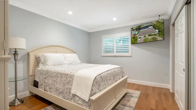 a bedroom with a bed and a window