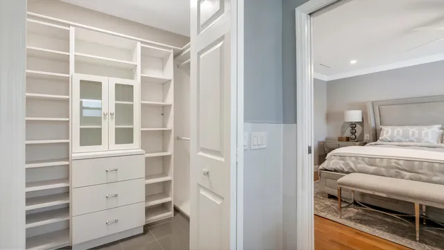 a bedroom with a bed and a lamp