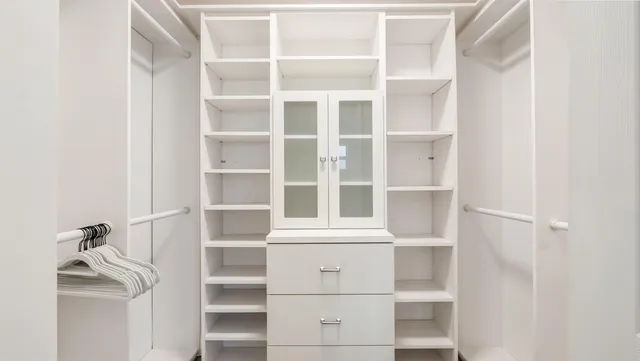 a dining room with furniture and a floor to ceiling window