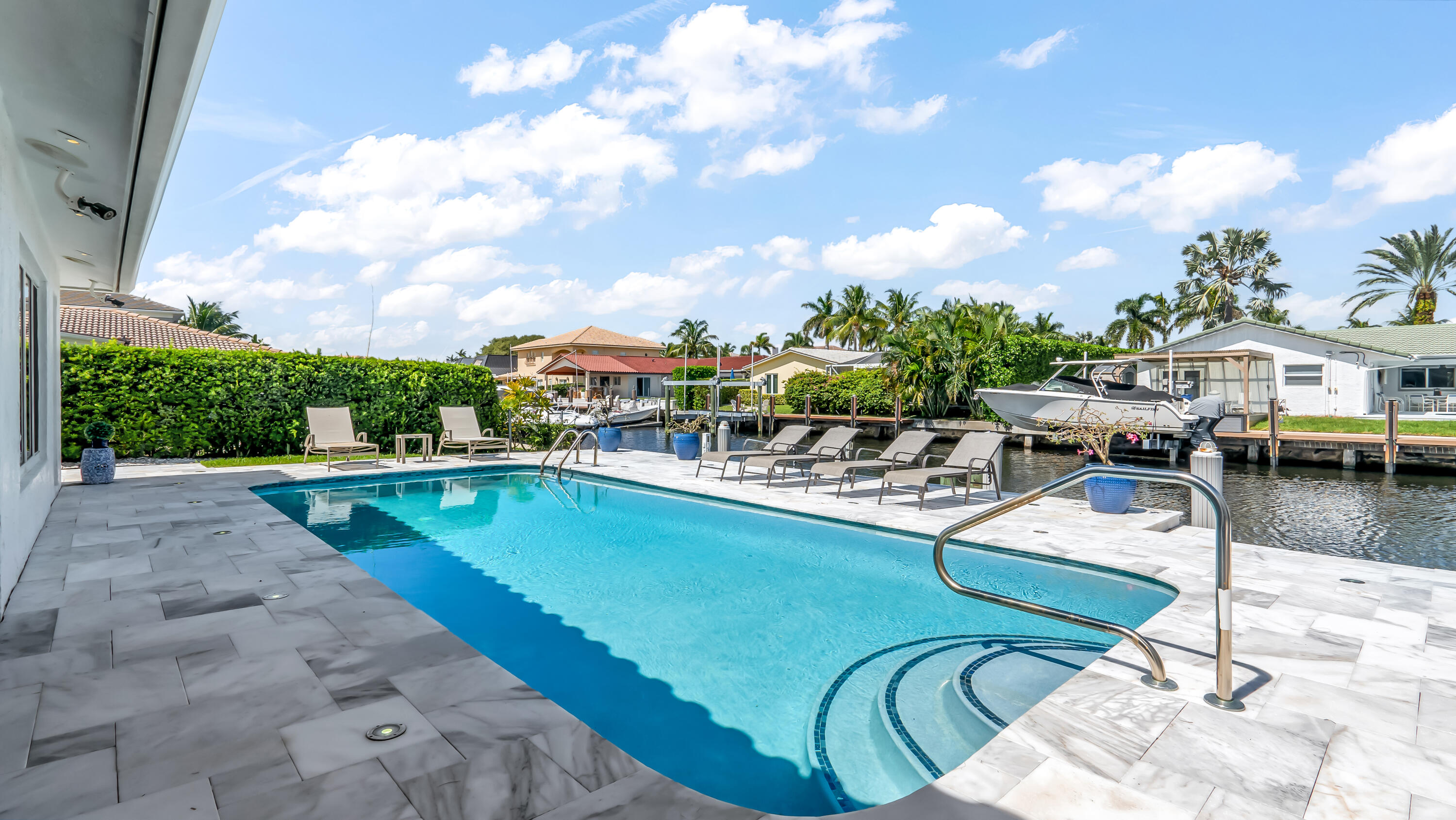 831 Dover Street Boca Raton, FL 33487 - Photo 44 of 54 a view of a swimming pool with outdoor seating