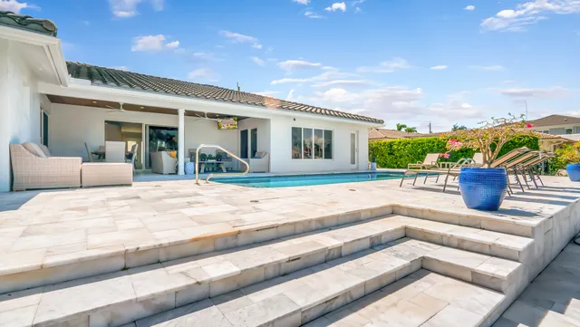 a view of a house with a swimming pool