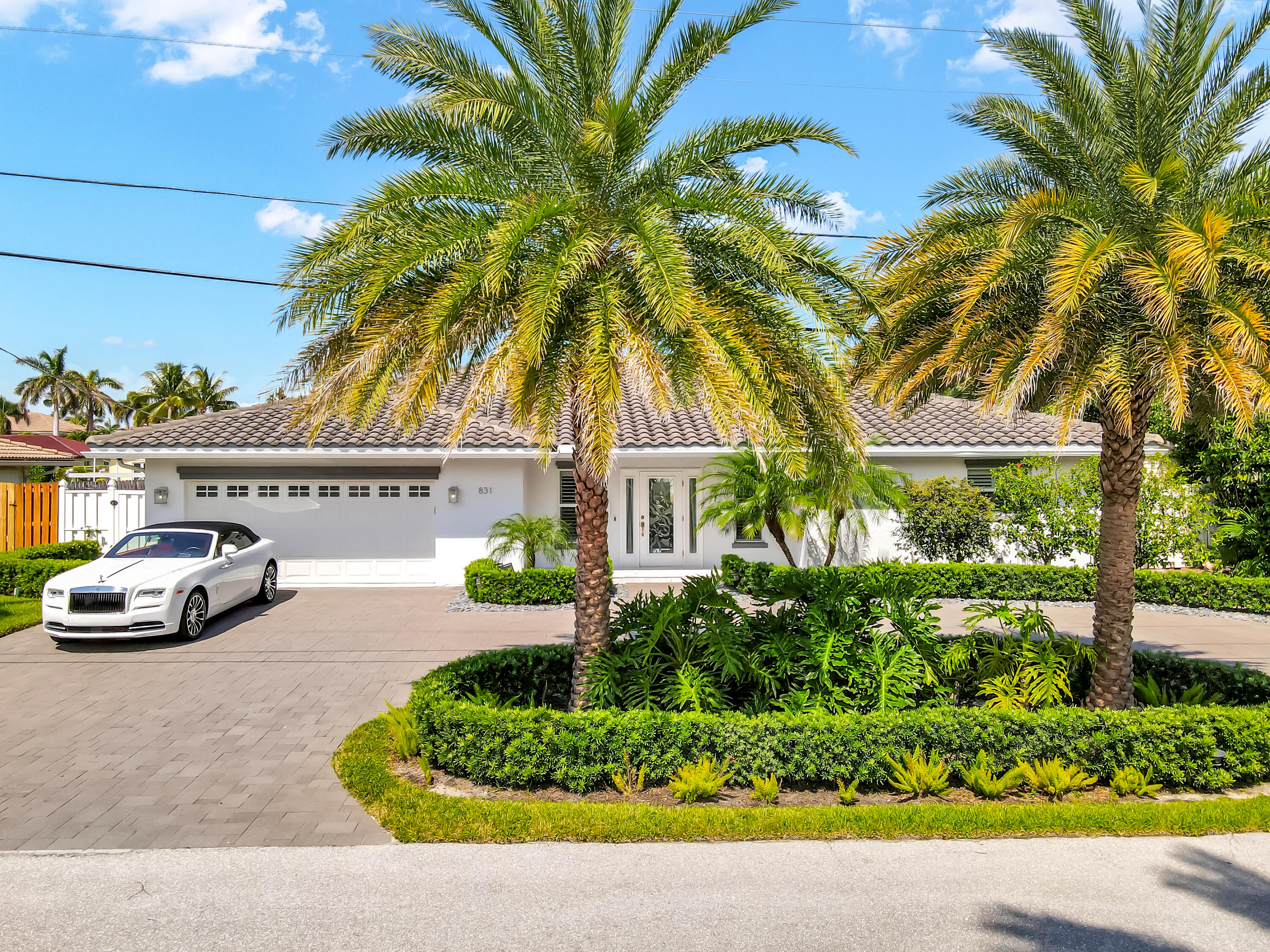 831 Dover Street Boca Raton, FL 33487 - Photo 5 of 54 a view of a street with a cars park side of a road