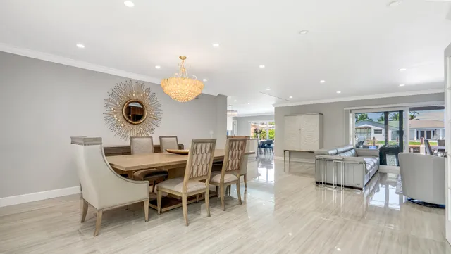 a living room with fireplace furniture and a wooden floor