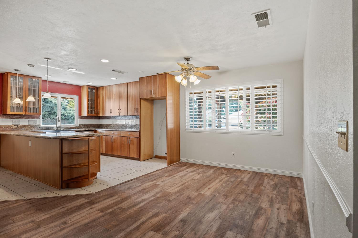 2179 Rall Avenue Clovis, CA 93611 - Photo 13 of 54 a kitchen with stainless steel appliances granite countertop a stove a sink and a refrigerator