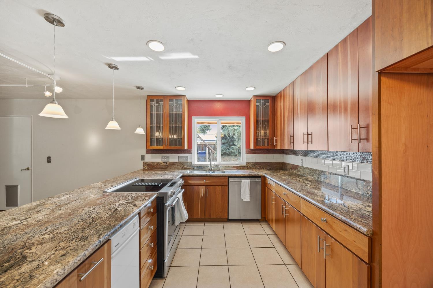 2179 Rall Avenue Clovis, CA 93611 - Photo 15 of 54 a kitchen with a sink and cabinets