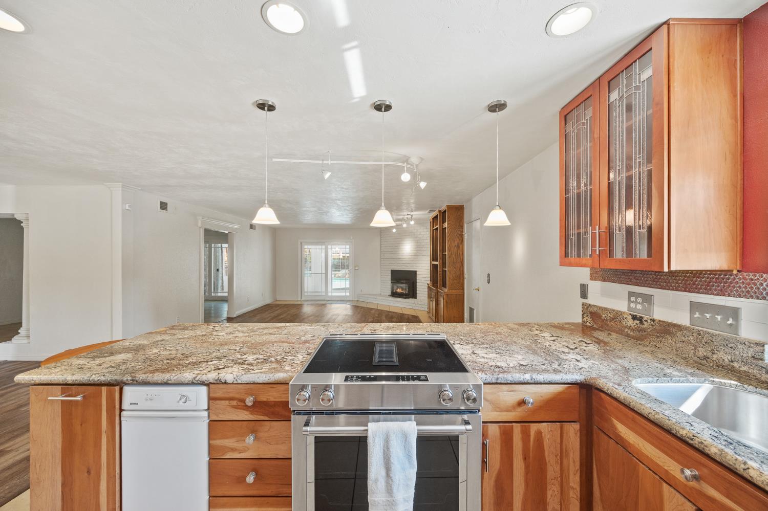 2179 Rall Avenue Clovis, CA 93611 - Photo 17 of 54 a kitchen with a stove and a sink
