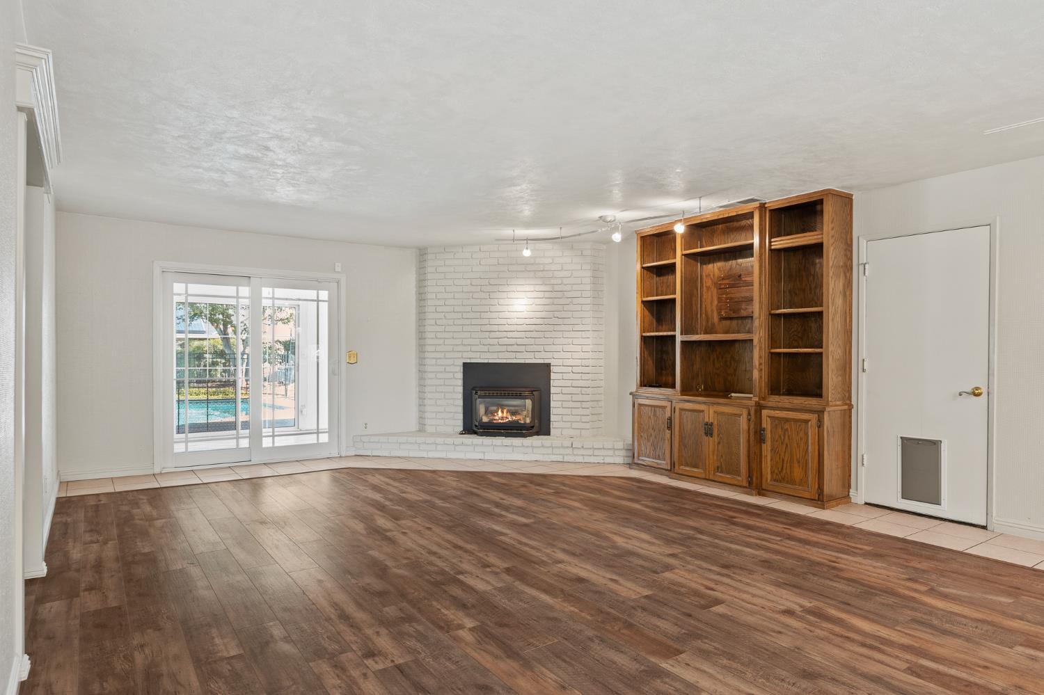 2179 Rall Avenue Clovis, CA 93611 - Photo 19 of 54 a view of an empty room with a window and fireplace