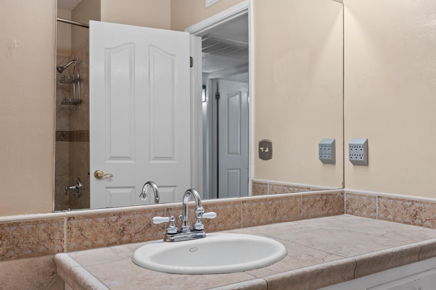 2179 Rall Avenue Clovis, CA 93611 - Photo 22 of 54 a bathroom with a sink and a mirror