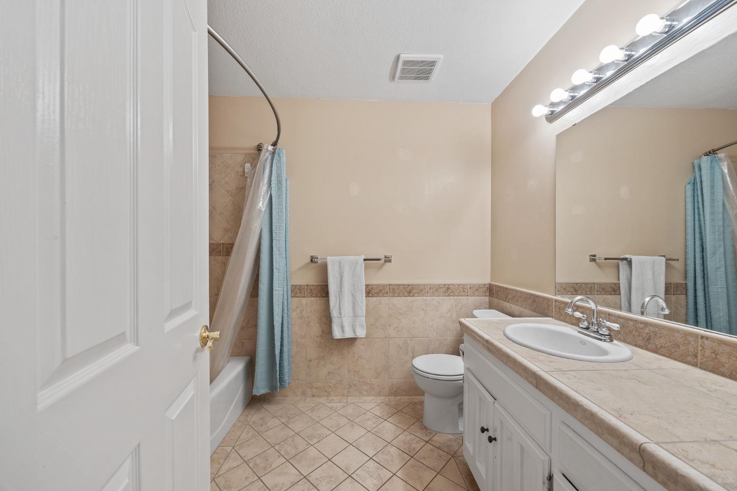 2179 Rall Avenue Clovis, CA 93611 - Photo 24 of 54 a bathroom with a double vanity sink toilet and shower
